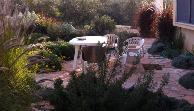 Natural stone paving and sitting corner at house entrance