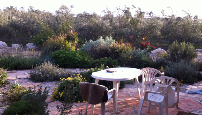 Natural stone paving and sitting corner at house entrance